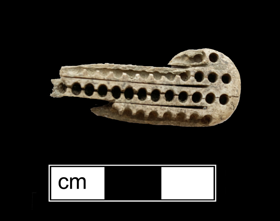 Image of bone toothbrush handle, wire drawn.