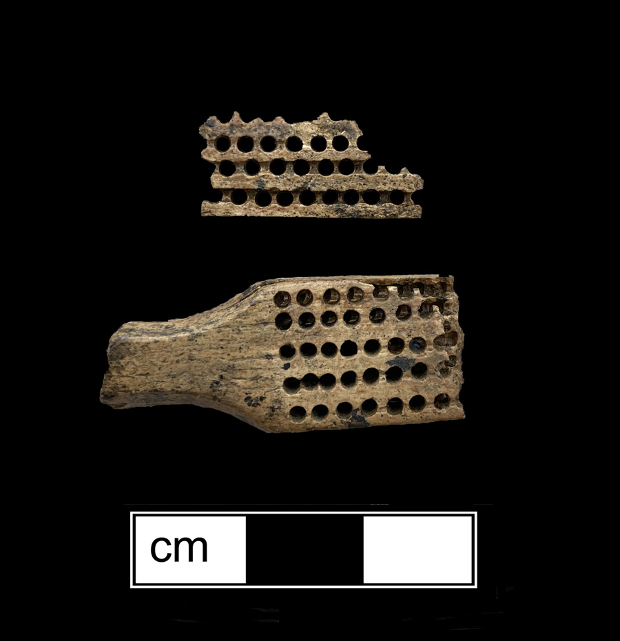 Image of bone toothbrush handle, trepanned.