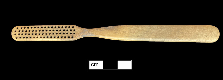 Image of bone toothbrush handle, trepanned, England type, Maryland variety.