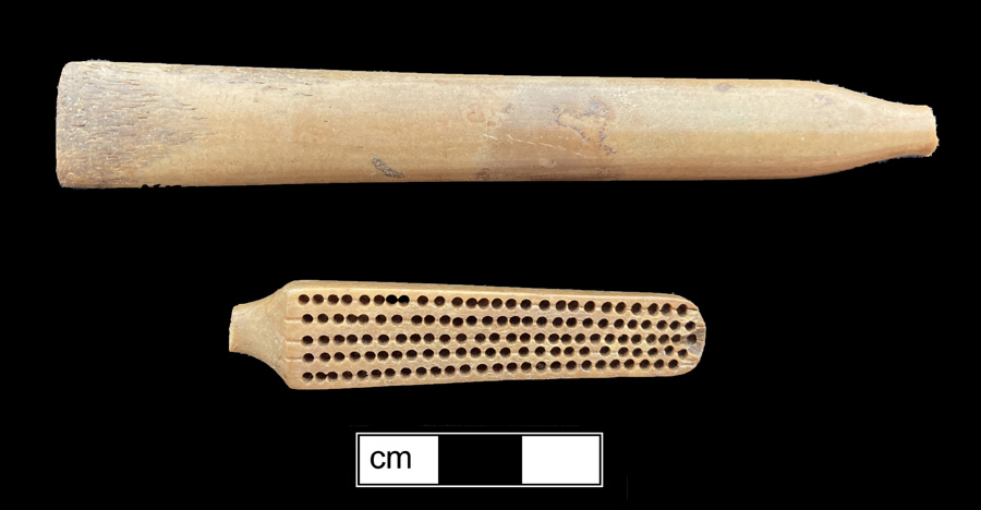 Image of bone toothbrush handle, trepanned, Virginia type.