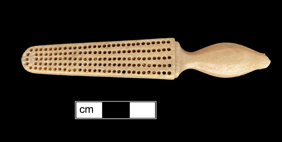 Image of bone toothbrush handle, trepanned, Virginia type.