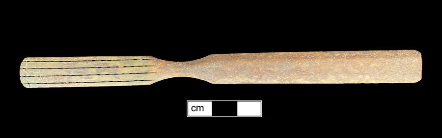 Image of bone toothbrush handle, wire drawn.