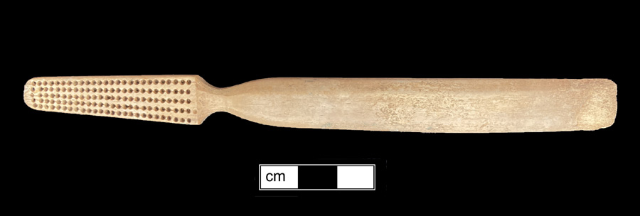 Image of bone toothbrush handle, trepanned, Virginia type.