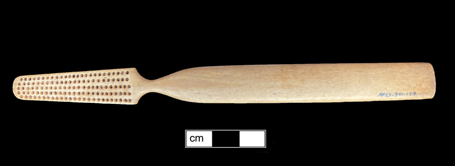 Image of bone toothbrush handle, trepanned, Virginia type.