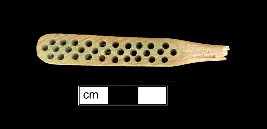 Image of bone toothbrush handle, wire drawn.