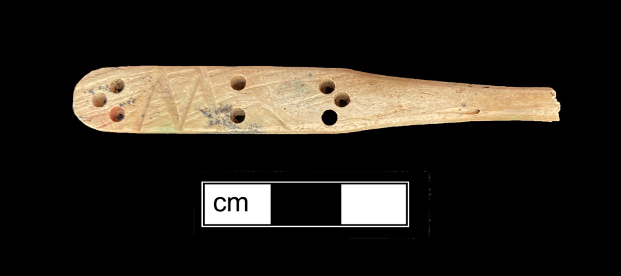 Image of bone toothbrush handle, wire drawn.