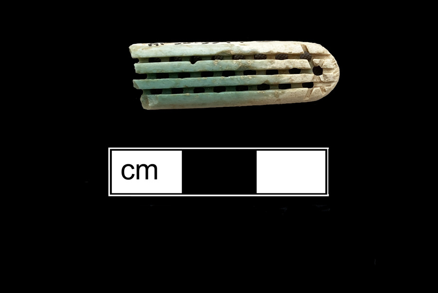 Image of bone toothbrush handle, wire drawn.