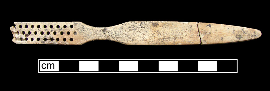 Image of bone toothbrush handle, trepanned, Florida type.