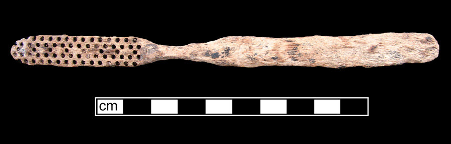 Image of bone toothbrush handle, wire drawn, Maple Leaf type.