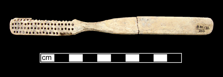 Image of bone toothbrush handle, trepanned, New England type, Philadelphia variety.