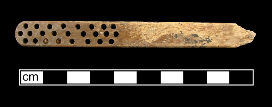Image of bone toothbrush handle, wire drawn.