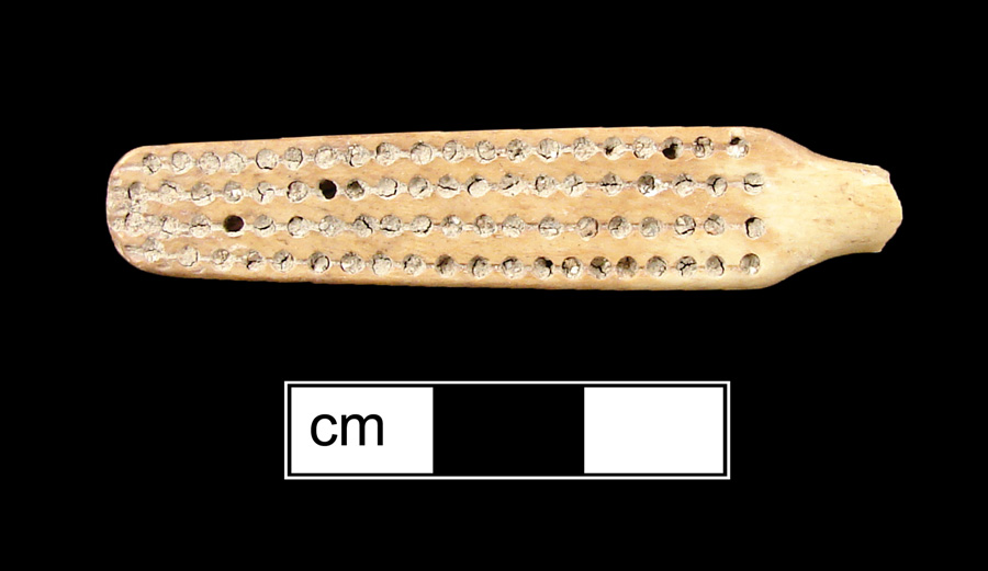 Image of bone toothbrush handle, trepanned, Virginia type.