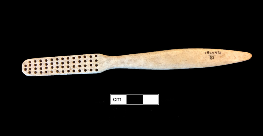 Image of bone toothbrush handle, trepanned, Georgia type.