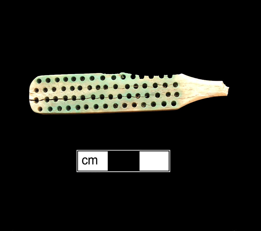 Image of bone toothbrush handle, wire drawn.