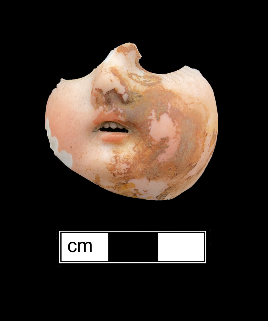 Image of porcelain bisque painted toy doll.
