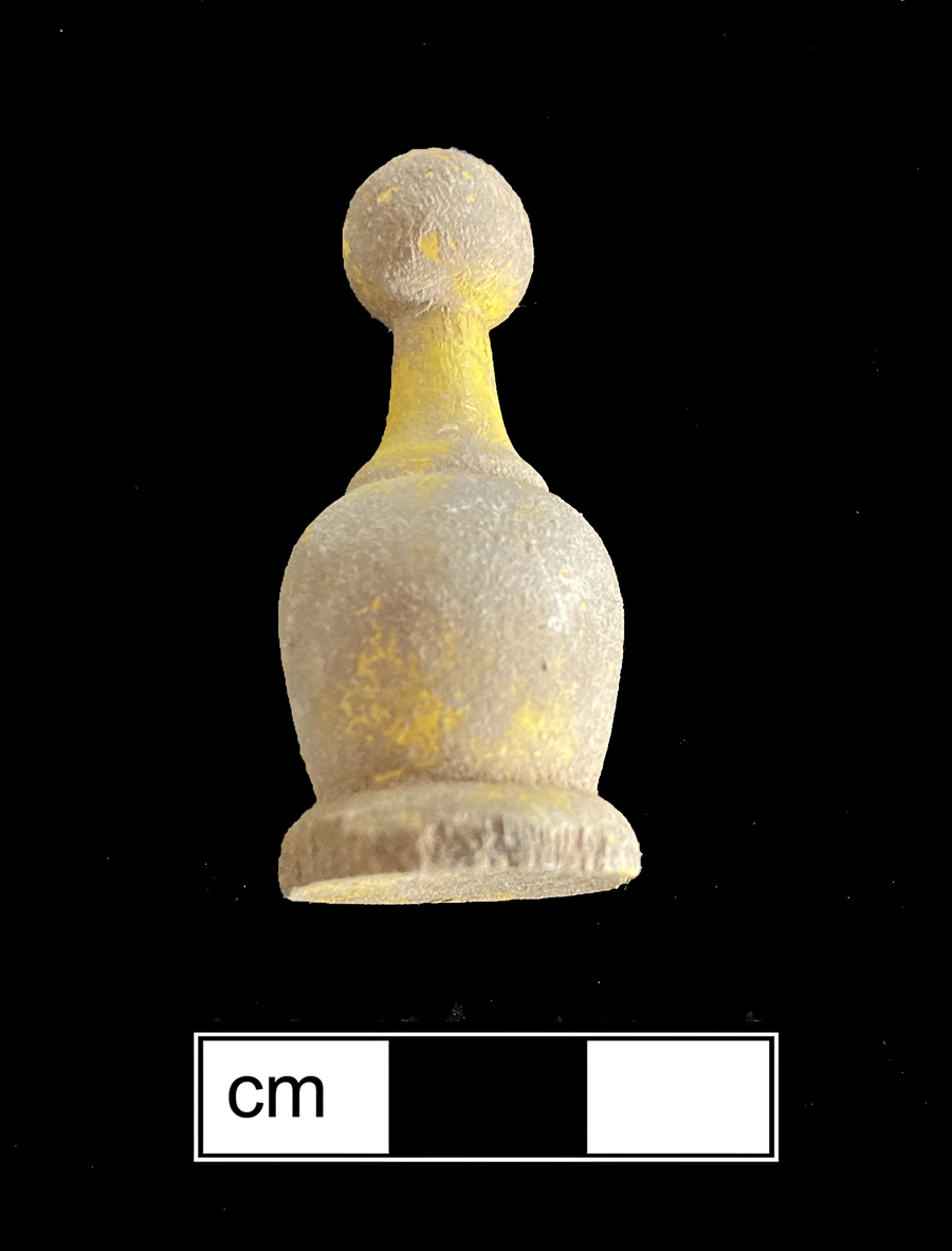 Image of wood game piece.
