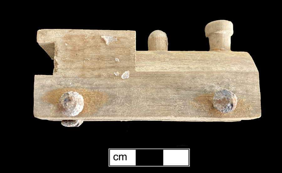 Image of wood/iron toy vehicle.