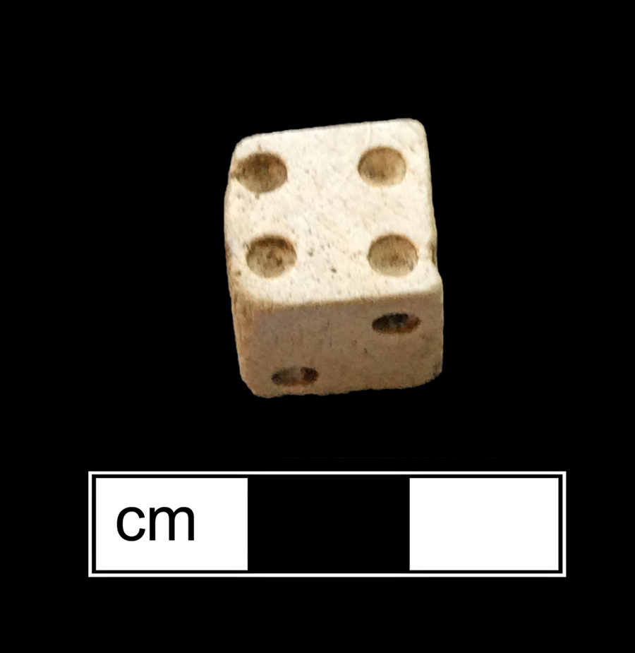Image of bone game piece.