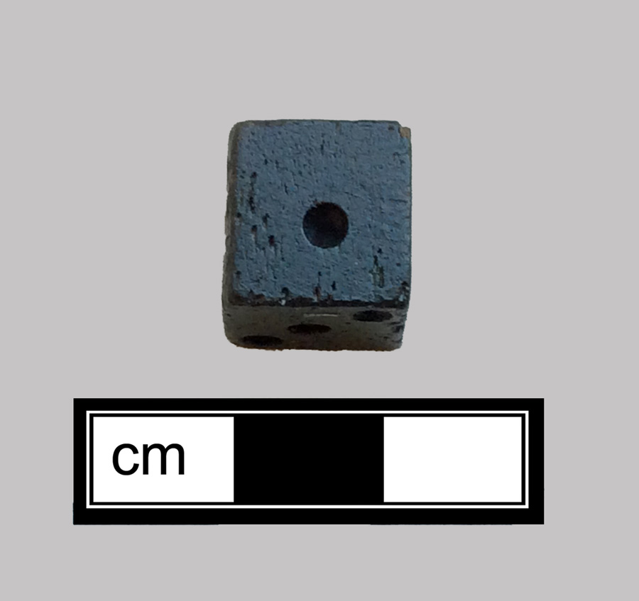 Image of bone game piece.