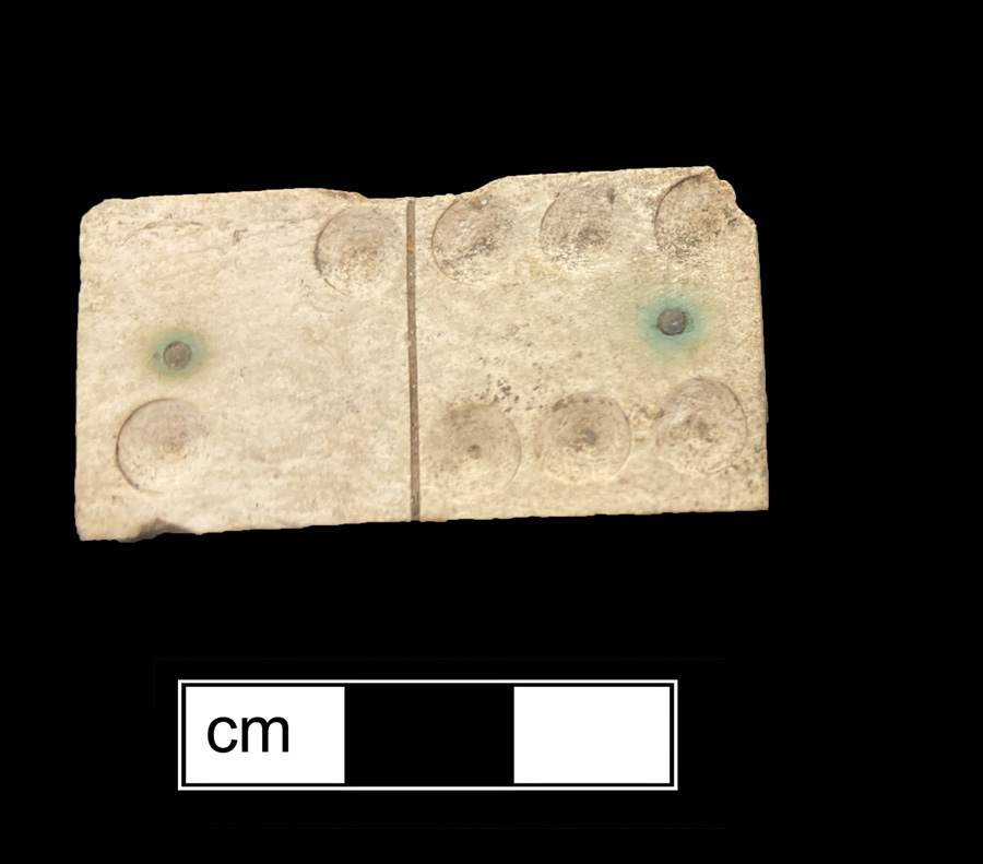 Image of bone/wood game piece.