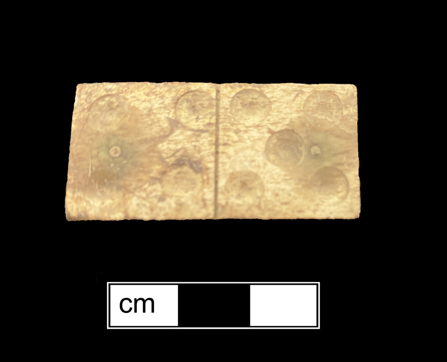Image of bone/wood game piece.