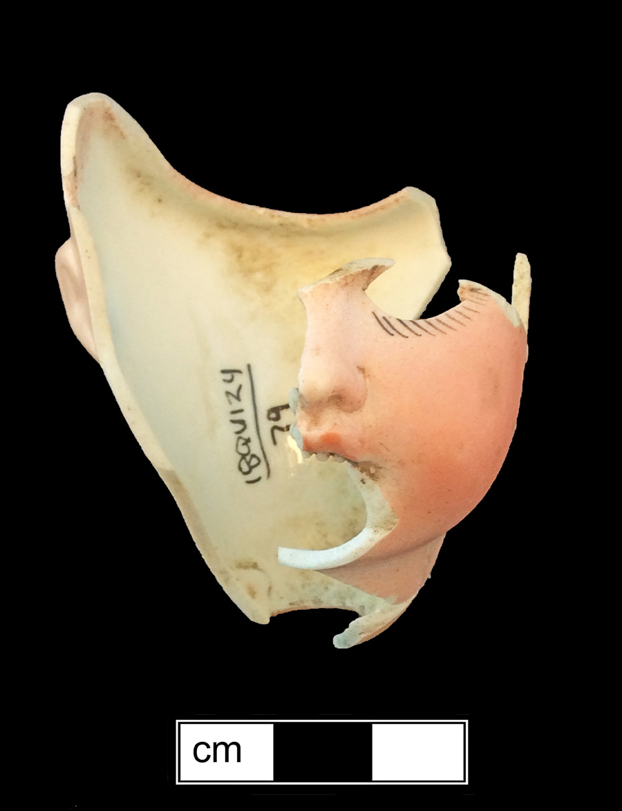 Image of porcelain bisque painted toy doll.