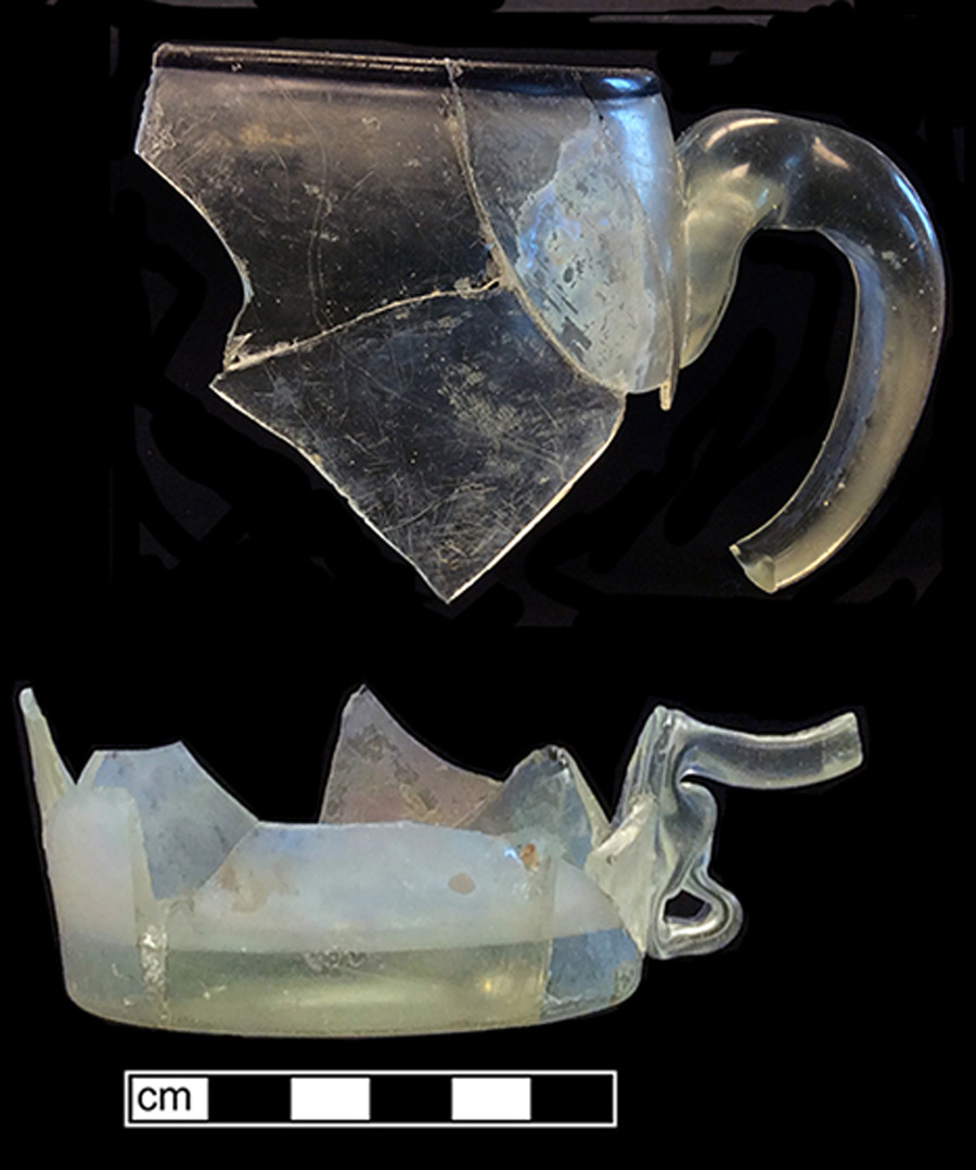 Image of colorless glass mug, glass-on-glass, hot glass decoration.