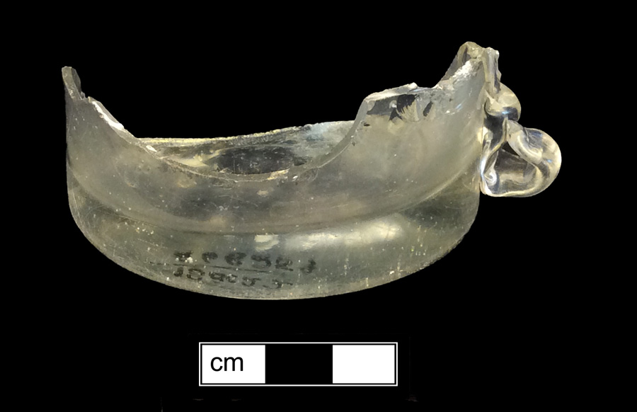 Image of colorless glass mug, glass-on-glass, hot glass decoration.