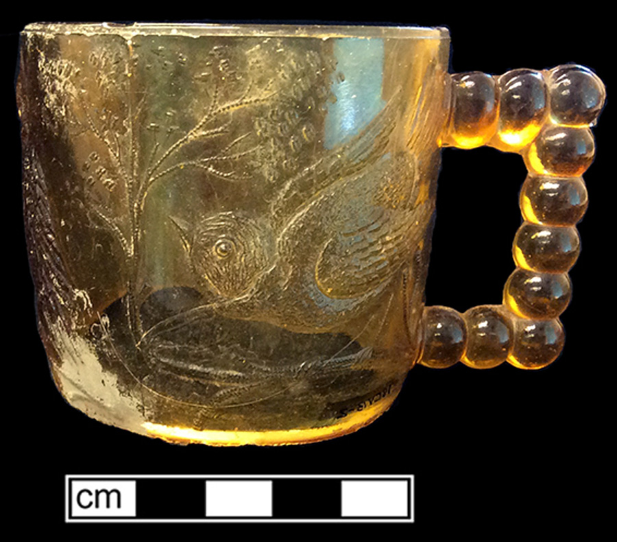 Image of colorless glass mug, hot glass decoration.