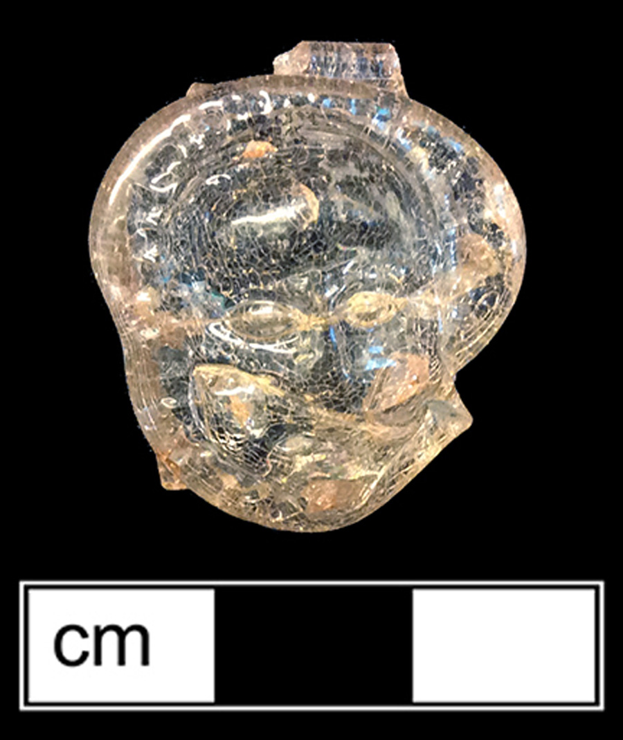 Image of colorless glass vessel, glass-on-glass, hot glass decoration.