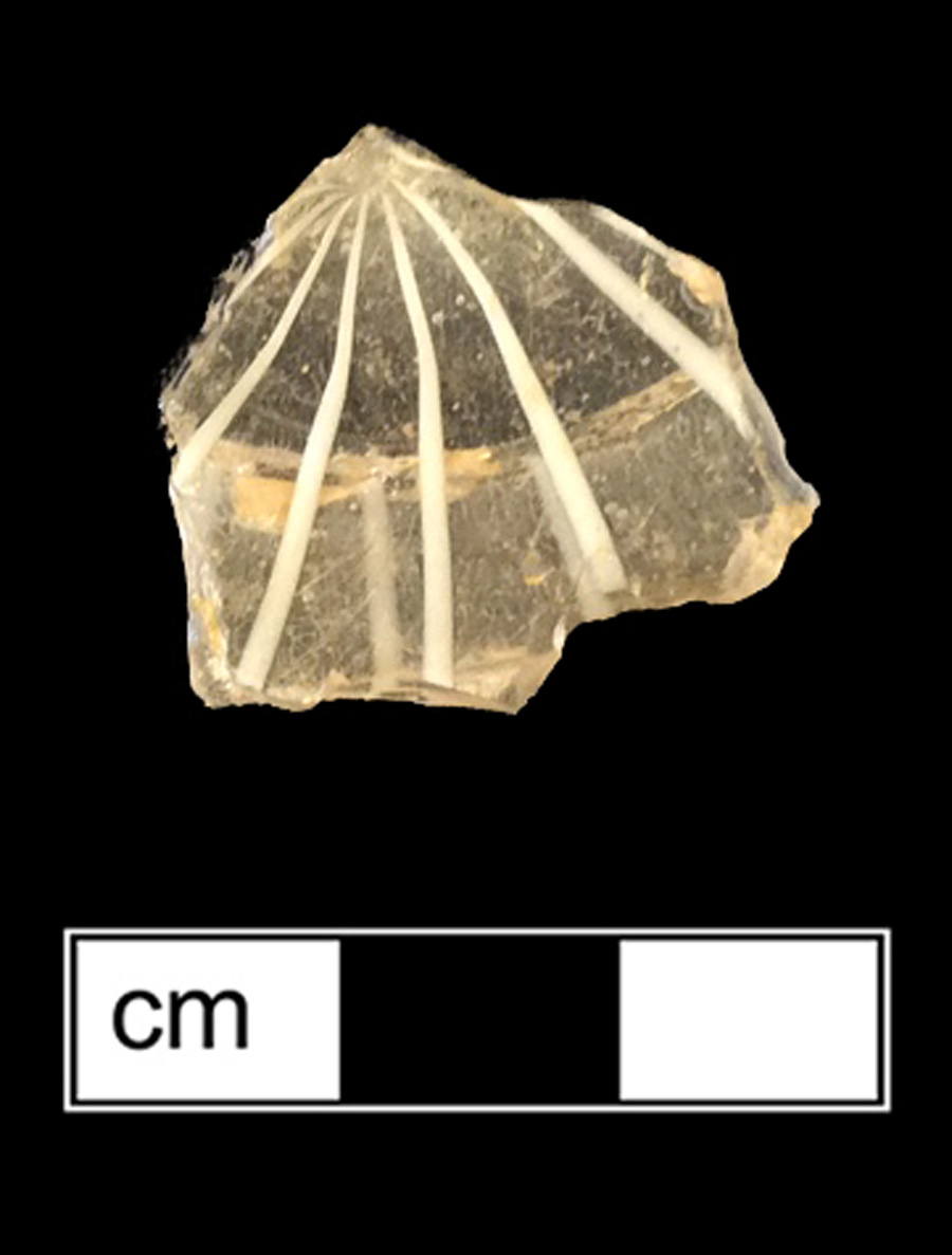 Image of colorless glass hollow vessel, glass-on-glass, hot glass decoration.