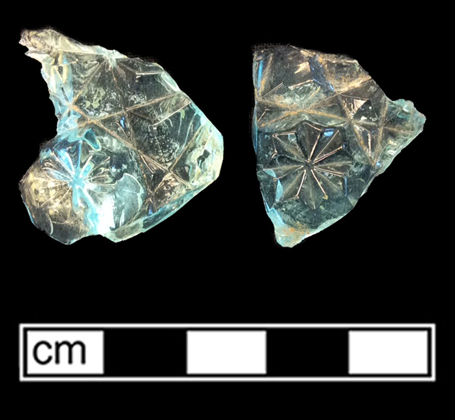 Image of transparent colored glass hollow vessel, hot glass decoration.