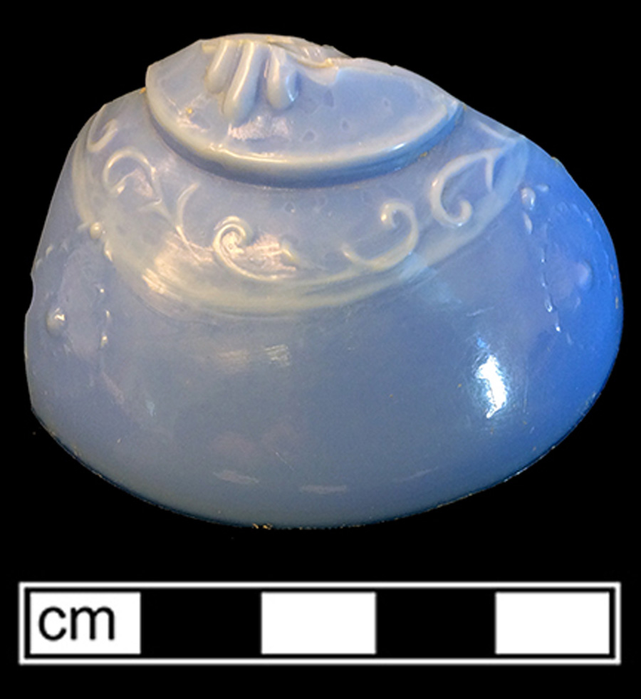 Image of opaque colored glass hollow vessel lid, hot glass decoration.