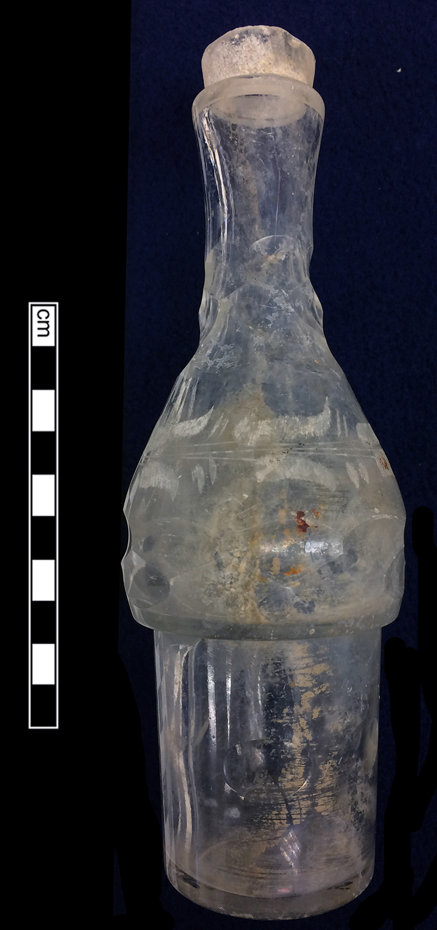 Image of colorless glass castor, abrasive decoration.
