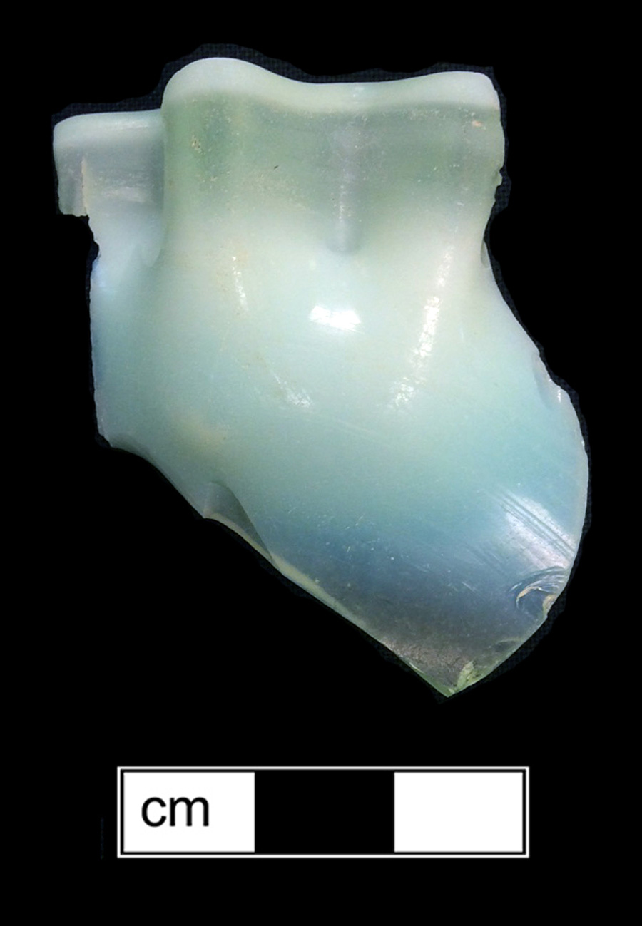 Image of colored glass vessel, uranium glass, opalescent glass.