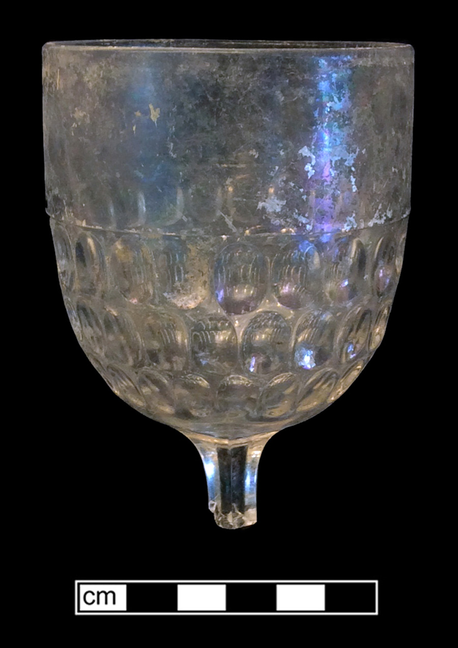 Image of colorless glass stemmed glass, hot glass decoration.