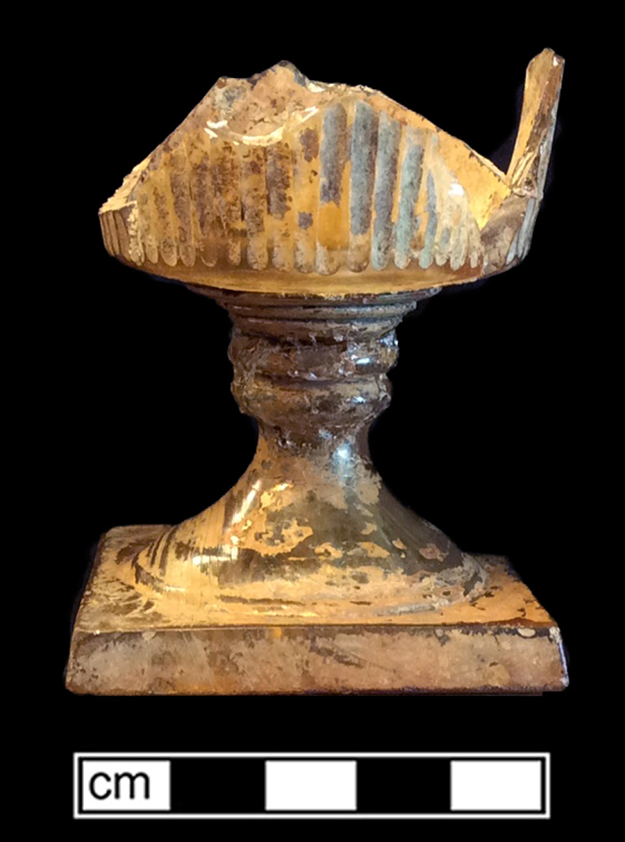 Image of colorless glass stemmed vessel, hot glass decoration.