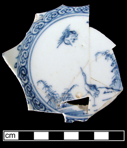 Chinese porcelain saucer painted underglaze blue with bird central motif. Spearhead motif (c. 1722-1797) encircling cavetto. 