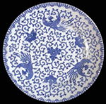Japanese porcelain printed underglaze in blue on plate in Phoenix Bird pattern.  Printed “Made in Japan” on reverse. Ross (2012:18) dates  the earliest print reference to this pattern to 1914, with simultaneous appearance in North America.