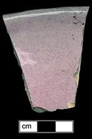 Hollow vessel in an unidentified form. Possibly bowl. Molded and painted linear motif. This vessel displays a pink interior glaze. Rim diameter: 5.00”, Vessel #:78. 18BC56