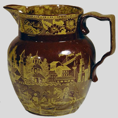 This jug is decorated with a Chinoserie-style motif.  The interior of the jug is coated with a white slip - private collection.