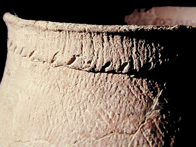 Shepard reconstructed vessel close up view of slashes along the rim strip, from the Shepard site 18MO3-SI Cat. #390889A. - Courtesy of the Smithsonian Institution, Museum of Natural History, Department of Anthropology.
