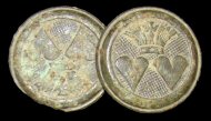 Cast copper alloy buttons with two hearts topped by a crown. It has been suggested that this motif commemorates a royal wedding (Noël Hume 1961) - click on image to see larger view.