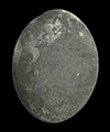 White metal oval link, possibly silver. There is no evidence of decoration, but the link has been burned and is covered in soot.