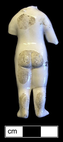 Small Frozen Charlotte doll. This example shows that the rear of the doll was not completely glazed. 18BC80 - These little Frozen Charlotte dolls were popular from 1850 to 1920. Most were produced in Germany, where they were called penny dolls (King 1981:560) and were originally intended as a bath toy. Small versions were sometimes baked into cakes as party favors, and others were used as dolls. They were named after a poem entitled “Young Charlotte”, about a girl who froze to death on the way to a party because she refused to cover up her dress with a coat.   