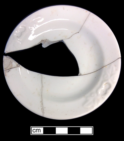 Porcelain plate sized for small child. Molded rim with double leaf motif. 18BC80