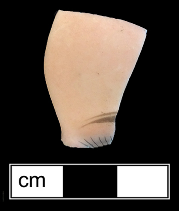 Painted bisque porcelain fragment of face of socket head doll with painted eyebrow and eyelashes from 18PR983.