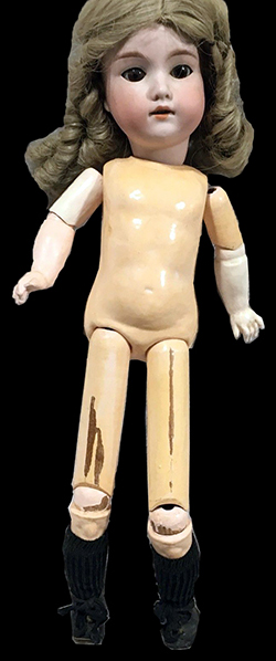 This complete doll, similarly marked, has a wooden and composition body.  Height 17.5”. Private collection.