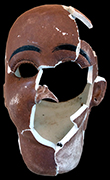 African-American doll head of painted bisque porcelain (also known as parian), with an impressed “5” on its neck. It also has holes for earrings. 11.5cm x 8cm x8cm - from 18MO609.
