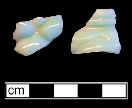 Opaque pale green press molded glass in unidentified hollow form. Lot 2. 18CV7